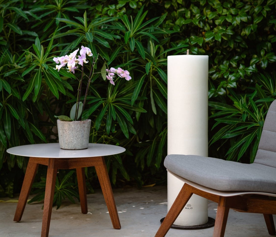MAJO extra large outdoor garden candle 1 metre tall with outdoor living area and designer garden furniture. Luxury garden furniture ideas. Luxury garden lighting ideas.